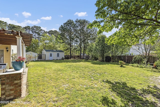 604 Lanvale Hills Cir, Leland, NC 28451 - view of yard with a pergola, a fenced backyard, a storage unit, and an outbuilding