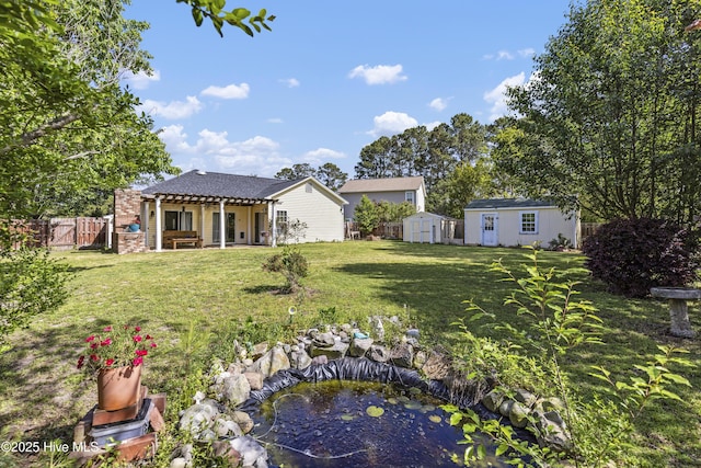 604 Lanvale Hills Cir, Leland, NC 28451 - view of yard with a fenced backyard, a storage unit, an outbuilding, and a patio