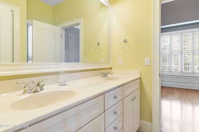 3675 W Medinah Ave, Southport, NC 28461 - full bath featuring a sink, double vanity, and wood finished floors