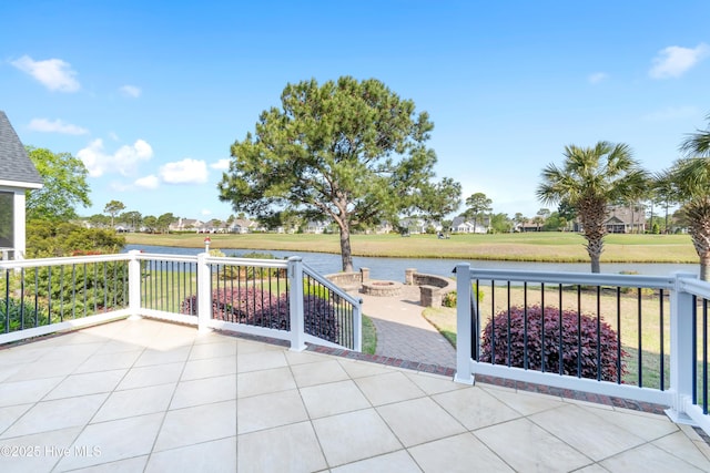 3675 W Medinah Ave, Southport, NC 28461 - view of patio / terrace featuring a water view and an outdoor fire pit