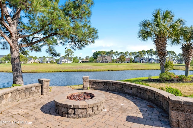 3675 W Medinah Ave, Southport, NC 28461 - view of patio / terrace featuring a water view, a residential view, and a fire pit