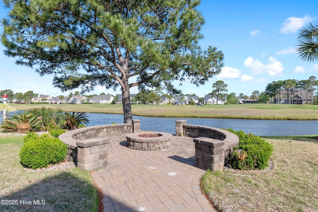 3675 W Medinah Ave, Southport, NC 28461 - surrounding community with a lawn, a water view, and a fire pit