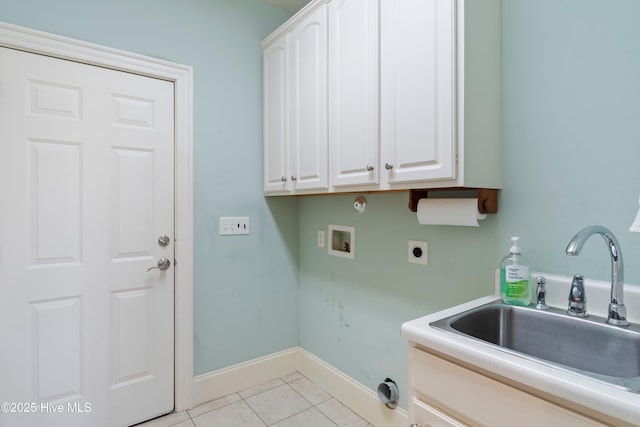 3675 W Medinah Ave, Southport, NC 28461 - laundry area featuring light tile patterned flooring, hookup for a washing machine, a sink, cabinet space, and hookup for an electric dryer