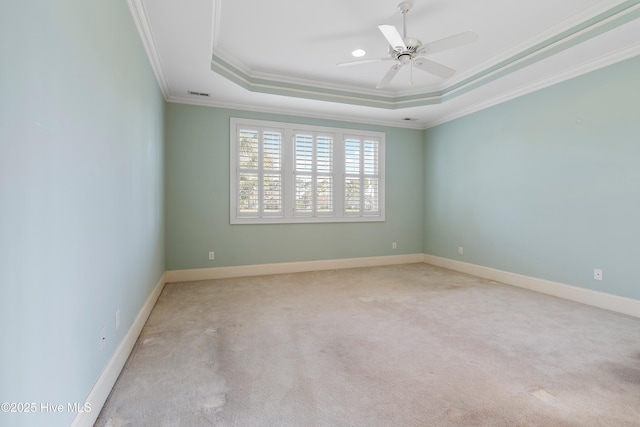 3675 W Medinah Ave, Southport, NC 28461 - unfurnished room featuring a ceiling fan, visible vents, a raised ceiling, carpet floors, and ornamental molding