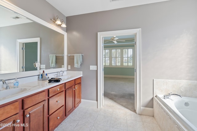3675 W Medinah Ave, Southport, NC 28461 - bathroom with tile patterned flooring, a sink, tiled bath, and double vanity