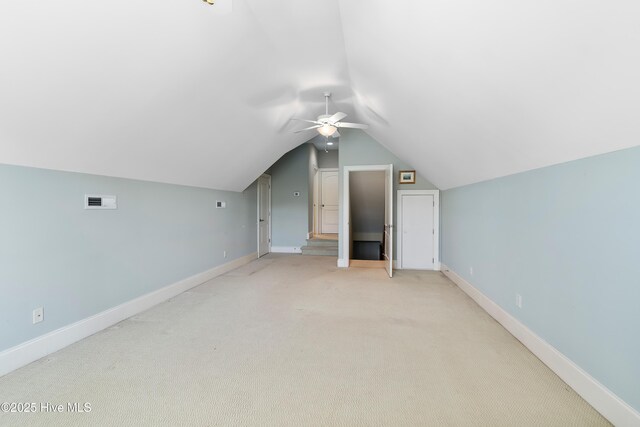 3675 W Medinah Ave, Southport, NC 28461 - bonus room with baseboards, ceiling fan, vaulted ceiling, and light colored carpet