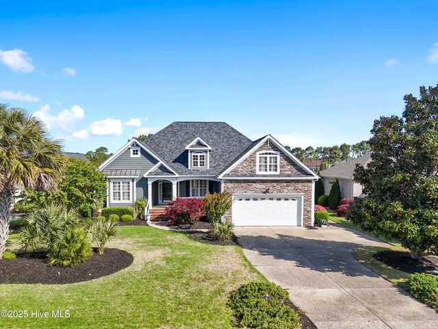 3675 W Medinah Ave, Southport, NC 28461 - view of front of house featuring a garage, a front lawn, stone siding, and concrete driveway