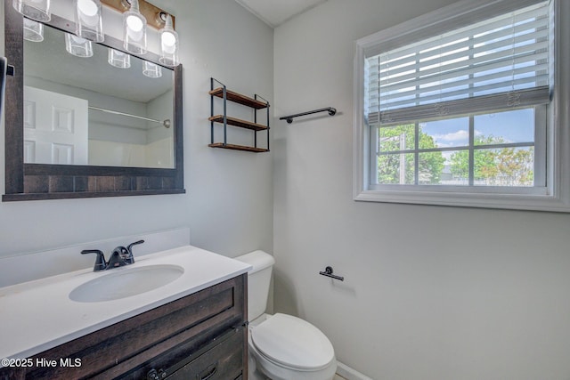 2715 Ashby Dr, Wilmington, NC 28411 - bathroom with baseboards, toilet, vanity, and a shower