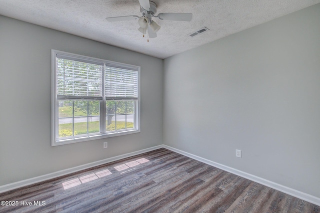 2715 Ashby Dr, Wilmington, NC 28411 - spare room featuring wood finished floors, visible vents, baseboards, a textured ceiling, and ceiling fan