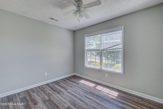 2715 Ashby Dr, Wilmington, NC 28411 - unfurnished room with a ceiling fan, wood finished floors, a textured ceiling, baseboards, and visible vents