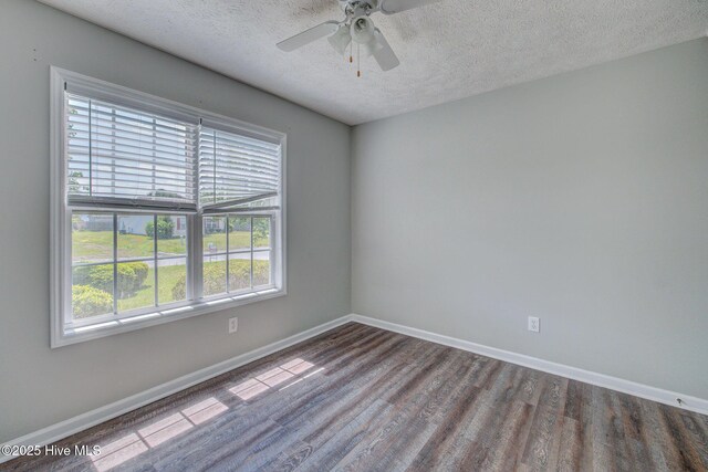 2715 Ashby Dr, Wilmington, NC 28411 - spare room with baseboards, wood finished floors, and a textured ceiling