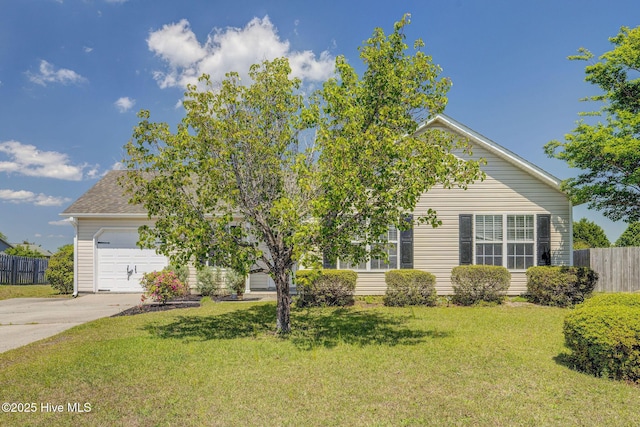 2715 Ashby Dr, Wilmington, NC 28411 - view of front facade featuring a front lawn, a garage, concrete driveway, and fence