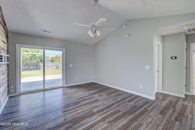 2715 Ashby Dr, Wilmington, NC 28411 - unfurnished living room featuring a textured ceiling, dark wood finished floors, visible vents, lofted ceiling, and ceiling fan