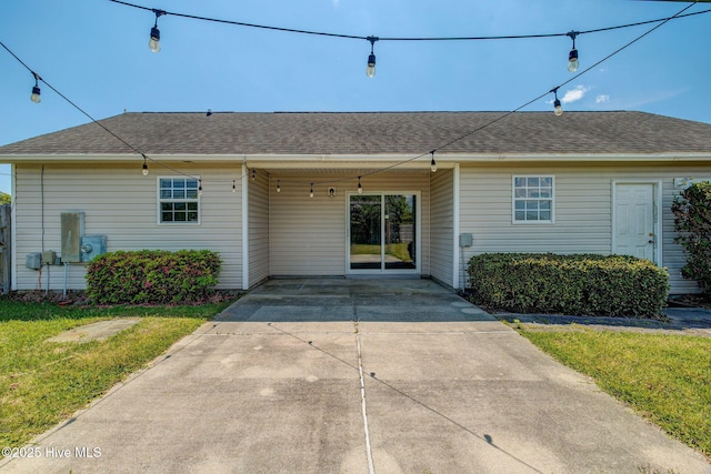 2715 Ashby Dr, Wilmington, NC 28411 - view of front of property featuring a carport, a shingled roof, a front lawn, and concrete driveway