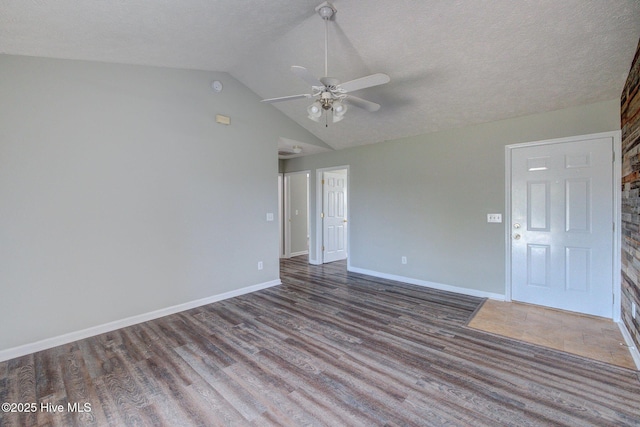 2715 Ashby Dr, Wilmington, NC 28411 - empty room with lofted ceiling, baseboards, wood finished floors, and ceiling fan