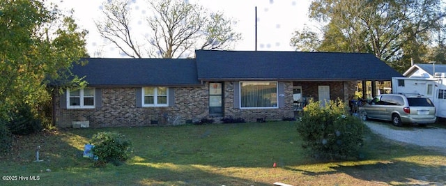 view of front of property featuring brick siding and a front lawn