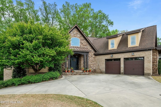 view of front of house featuring brick siding, driveway, an attached garage, and a shingled roof