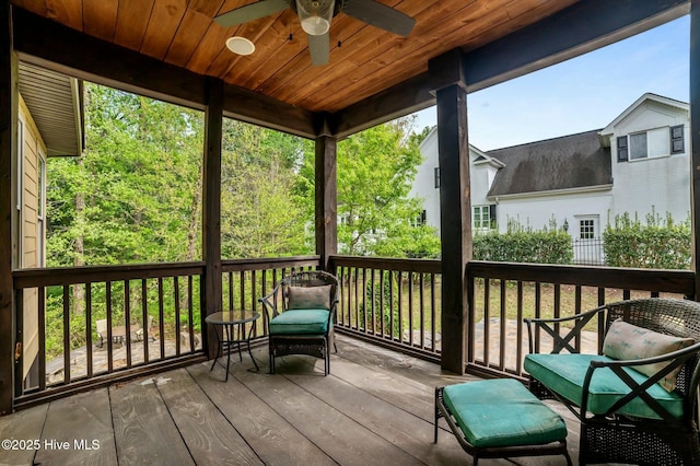 wooden terrace with a ceiling fan