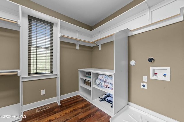 interior space featuring dark wood finished floors and visible vents