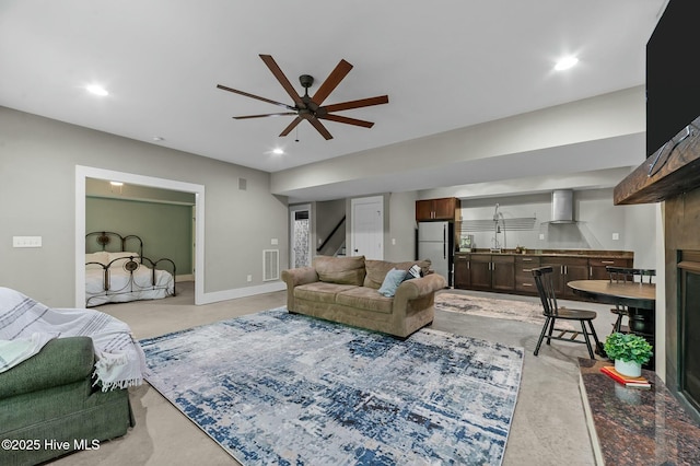 living area with ceiling fan, visible vents, recessed lighting, stairway, and light carpet