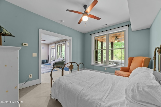 bedroom with visible vents, baseboards, and ceiling fan