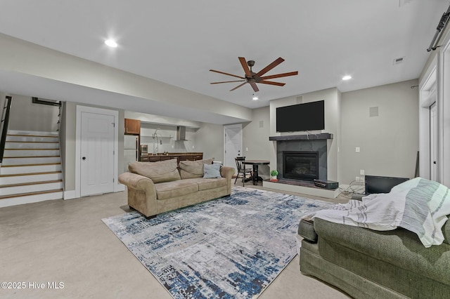 living area with visible vents, a ceiling fan, stairway, recessed lighting, and bar