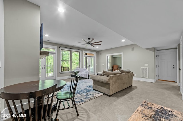 living room featuring recessed lighting, visible vents, baseboards, and concrete flooring