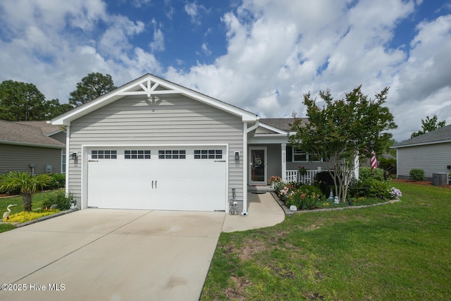 4238 Cherry Laurel Ln SE, Southport, NC 28461 - ranch-style house featuring a porch, a front yard, concrete driveway, and an attached garage