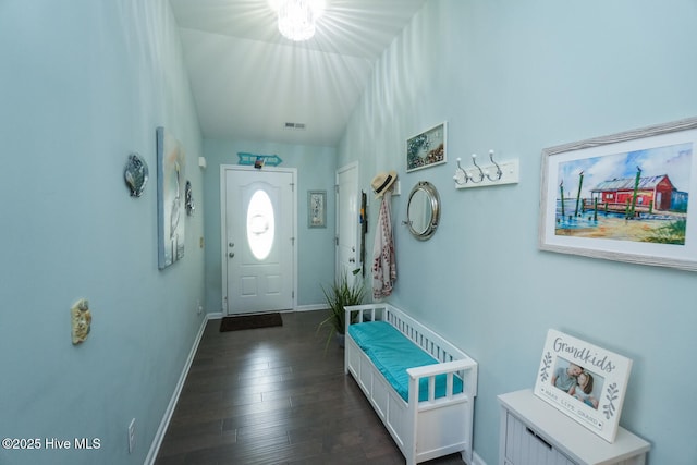 4238 Cherry Laurel Ln SE, Southport, NC 28461 - foyer entrance with baseboards and dark wood-style flooring