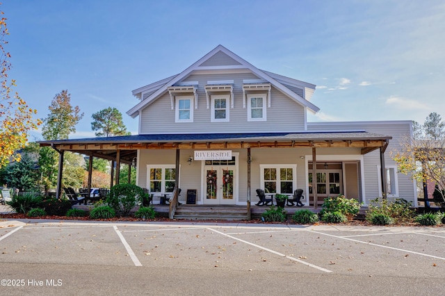 3722 White Cliffs Dr, Castle Hayne, NC 28429 - view of front of property with uncovered parking, french doors, and a porch