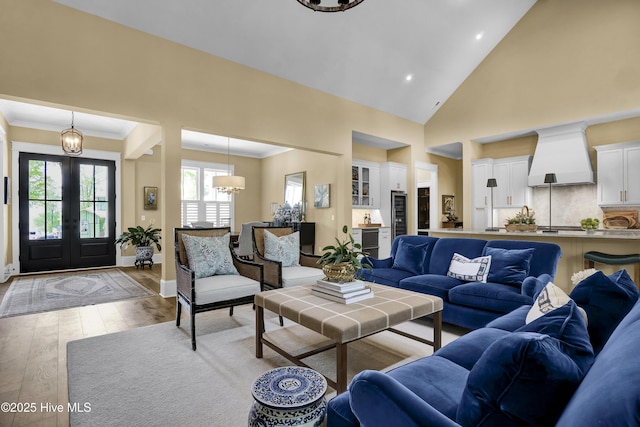 3722 White Cliffs Dr, Castle Hayne, NC 28429 - living area with a chandelier, french doors, light wood finished floors, recessed lighting, and crown molding