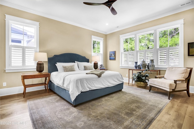 3722 White Cliffs Dr, Castle Hayne, NC 28429 - bedroom with hardwood / wood-style floors, baseboards, crown molding, and a ceiling fan
