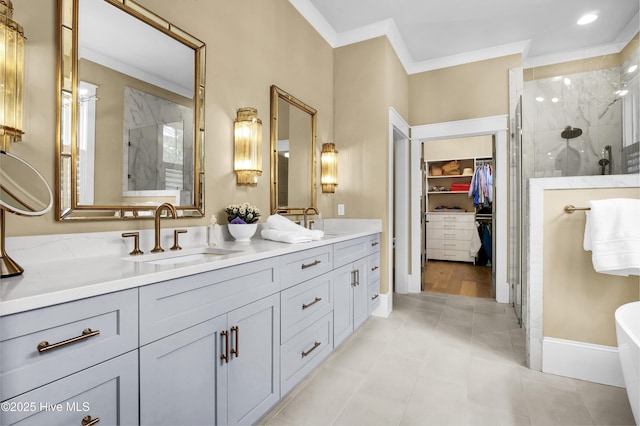 3722 White Cliffs Dr, Castle Hayne, NC 28429 - bathroom featuring a marble finish shower, double vanity, crown molding, a walk in closet, and a soaking tub