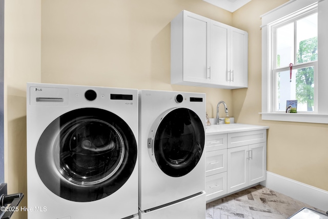 3722 White Cliffs Dr, Castle Hayne, NC 28429 - laundry room featuring washing machine and clothes dryer, cabinet space, and baseboards