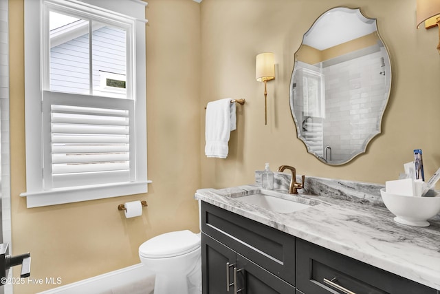 3722 White Cliffs Dr, Castle Hayne, NC 28429 - bathroom featuring vanity, toilet, and baseboards