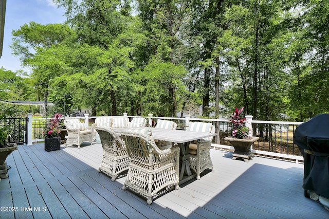 3722 White Cliffs Dr, Castle Hayne, NC 28429 - wooden terrace featuring an outdoor hangout area, outdoor dining space, area for grilling, and view of scattered trees