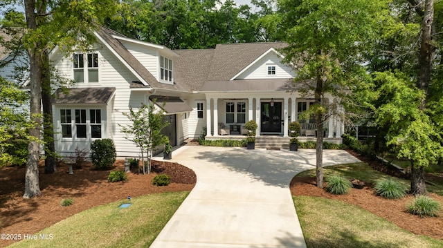 3722 White Cliffs Dr, Castle Hayne, NC 28429 - view of front of home with covered porch, driveway, a shingled roof, and a garage