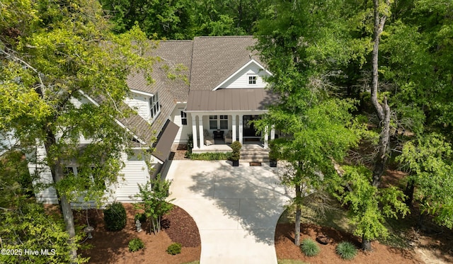 3722 White Cliffs Dr, Castle Hayne, NC 28429 - view of front facade featuring stairway, a standing seam roof, and metal roof