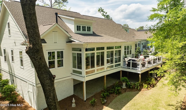 3722 White Cliffs Dr, Castle Hayne, NC 28429 - rear view of property with a shingled roof, a wooden deck, and a sunroom