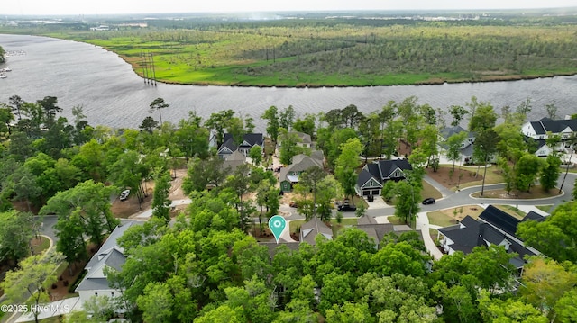 3722 White Cliffs Dr, Castle Hayne, NC 28429 - aerial view of residential area featuring a nearby body of water and a heavily wooded area