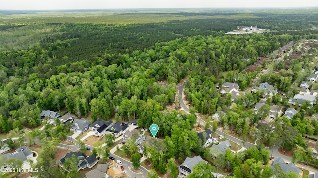3722 White Cliffs Dr, Castle Hayne, NC 28429 - aerial view of property and surrounding area with a heavily wooded area and nearby suburban area