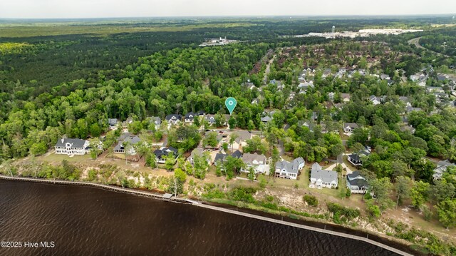3722 White Cliffs Dr, Castle Hayne, NC 28429 - aerial view of property's location featuring a heavily wooded area, a nearby body of water, and nearby suburban area