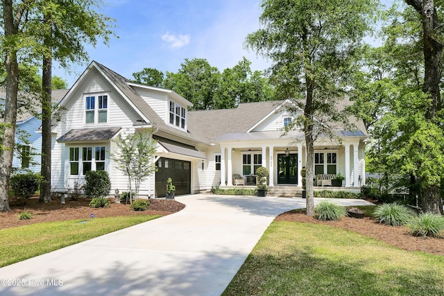 3722 White Cliffs Dr, Castle Hayne, NC 28429 - view of front of property with a porch, driveway, a garage, a shingled roof, and a front yard