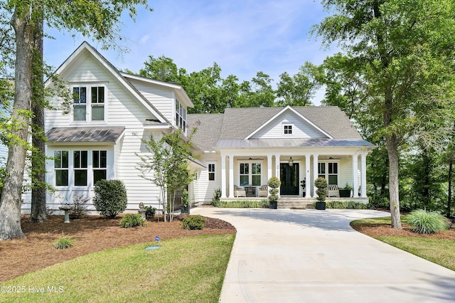 3722 White Cliffs Dr, Castle Hayne, NC 28429 - view of front of property with a porch, driveway, ceiling fan, and metal roof