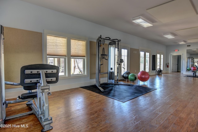 3722 White Cliffs Dr, Castle Hayne, NC 28429 - exercise room featuring wood finished floors and baseboards