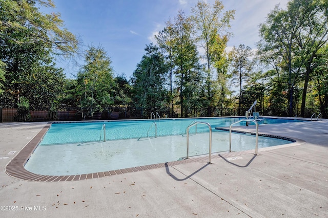 3722 White Cliffs Dr, Castle Hayne, NC 28429 - community pool with view of wooded area and a patio area