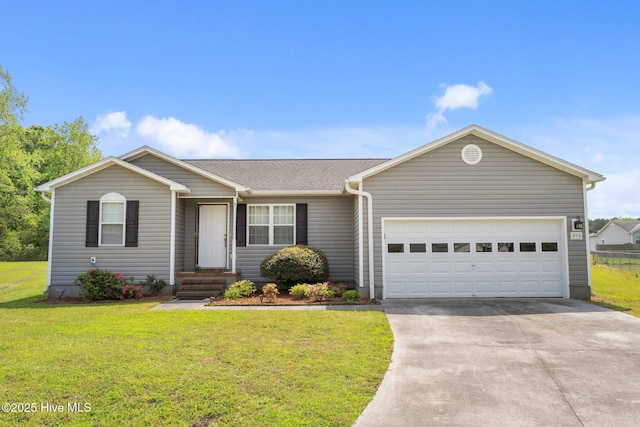 ranch-style home featuring a garage, a front lawn, and concrete driveway