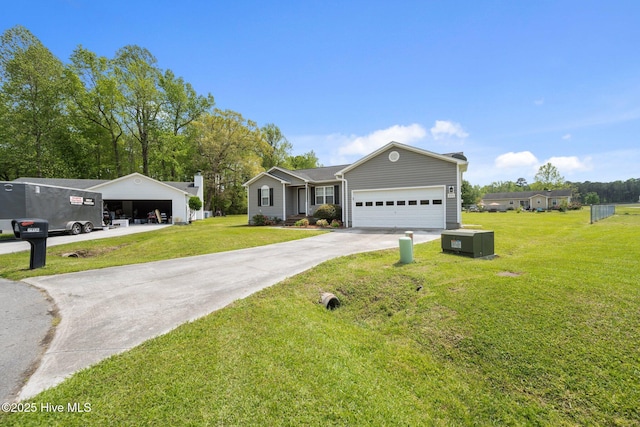 ranch-style home featuring driveway, a front yard, and a garage