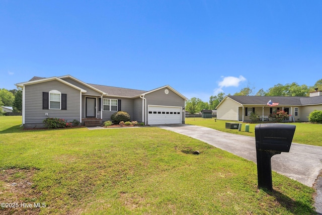 single story home with a garage, a front yard, and concrete driveway