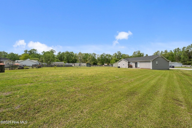 view of yard with fence